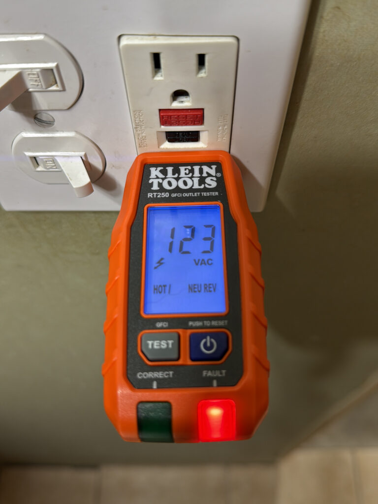 Testing a GFCI outlet during a professional home inspection